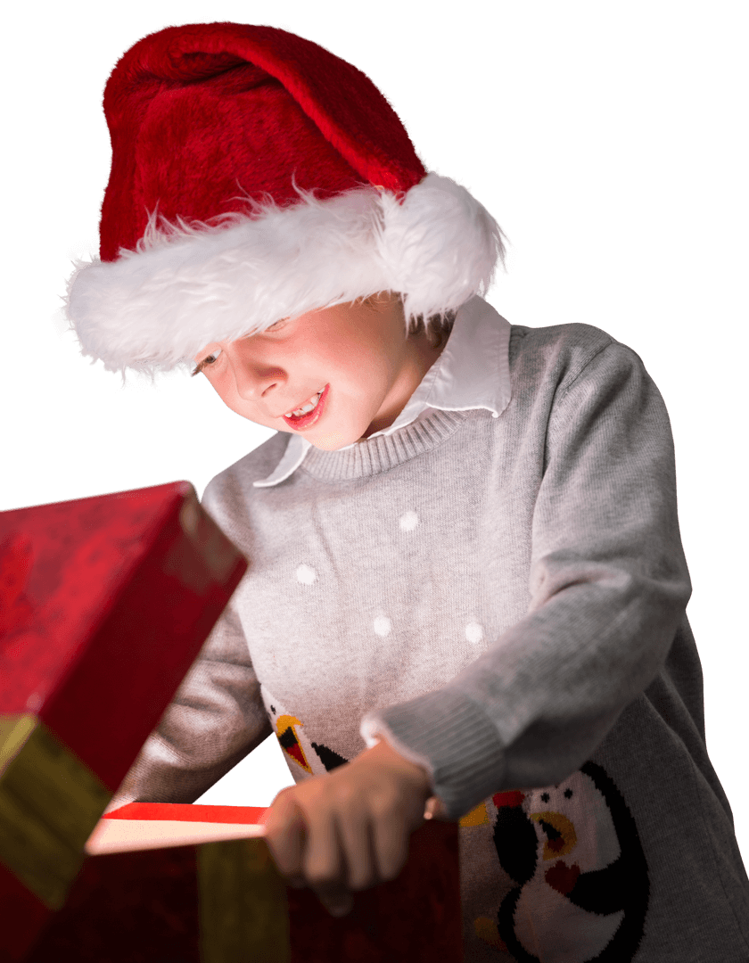 Caucasian Boy with Santa Hat Joyfully Opening Christmas Present on Transparent Background
