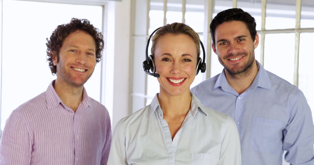 Smiling Customer Service Team in Modern Office Environment