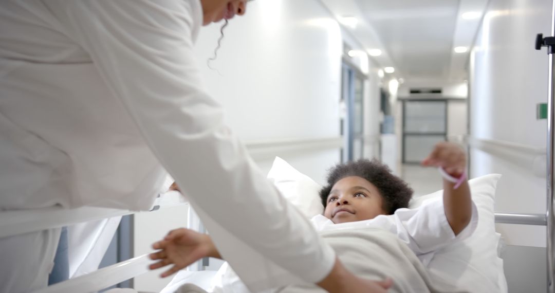 Doctor Checking Young African American Girl in Hospital Bed - Free Images, Stock Photos and Pictures on Pikwizard.com