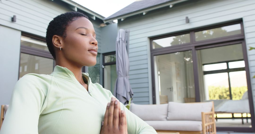 Serene Woman Meditating Outdoors in Garden - Free Images, Stock Photos and Pictures on Pikwizard.com