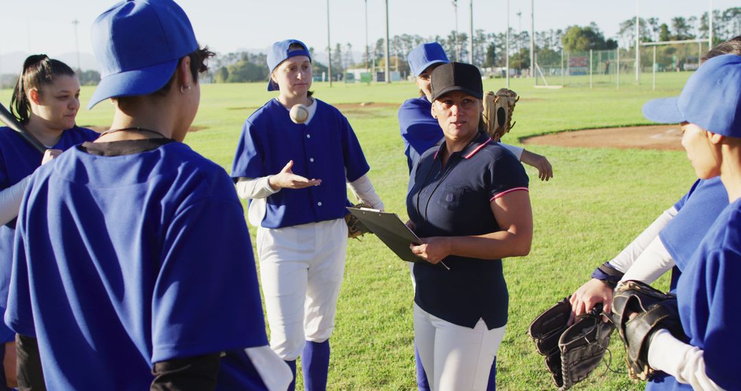 Softball Team Receiving Instructions from Coach on Field - Free Images, Stock Photos and Pictures on Pikwizard.com