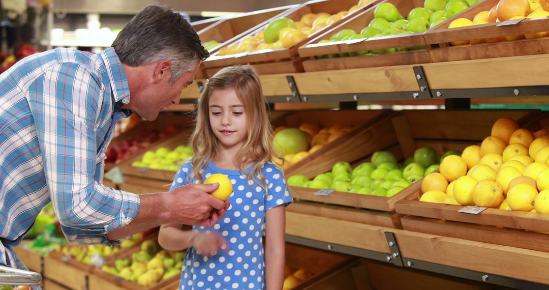 Father and Daughter Shopping for Fresh Fruits at Grocery Store - Free Images, Stock Photos and Pictures on Pikwizard.com