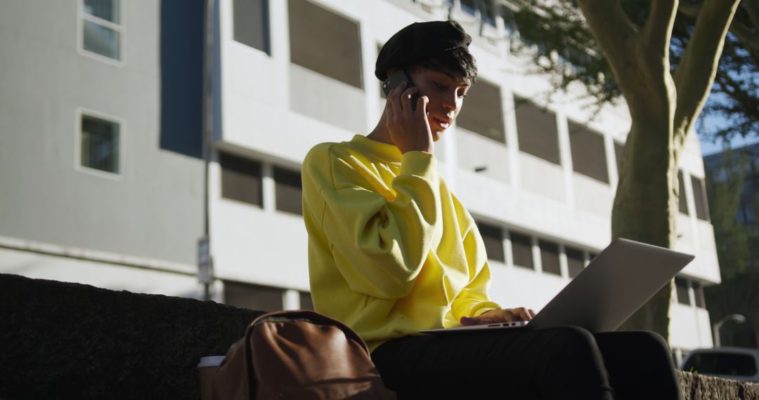 Young Woman in Yellow Sweater Working on Laptop Outdoors - Free Images, Stock Photos and Pictures on Pikwizard.com