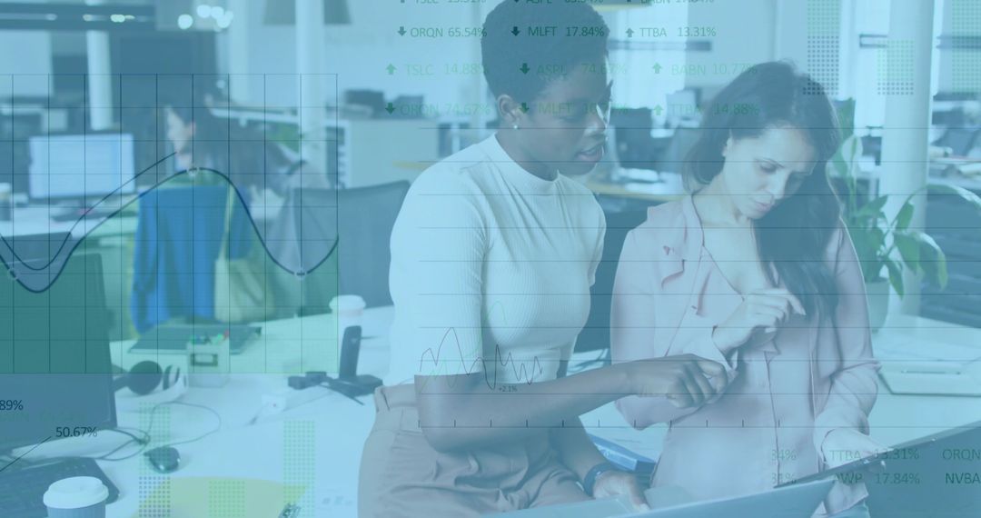 Female Colleagues Analyzing Data Together in Open Office