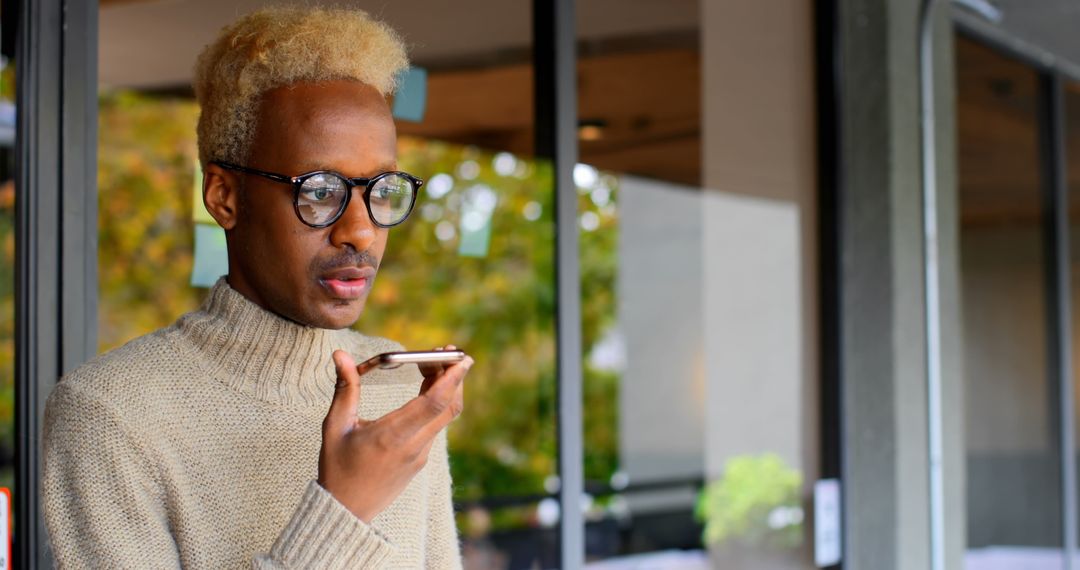 Young Professional Using Smartphone Voice Command Outdoors