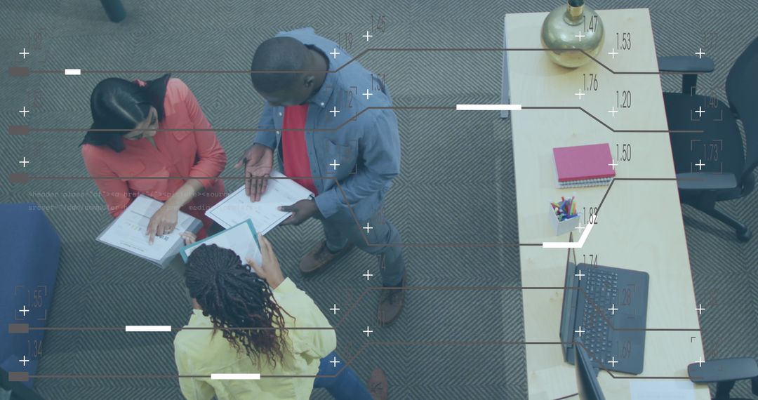 Diverse Team Discussing Reports with Digital Coding Overlay