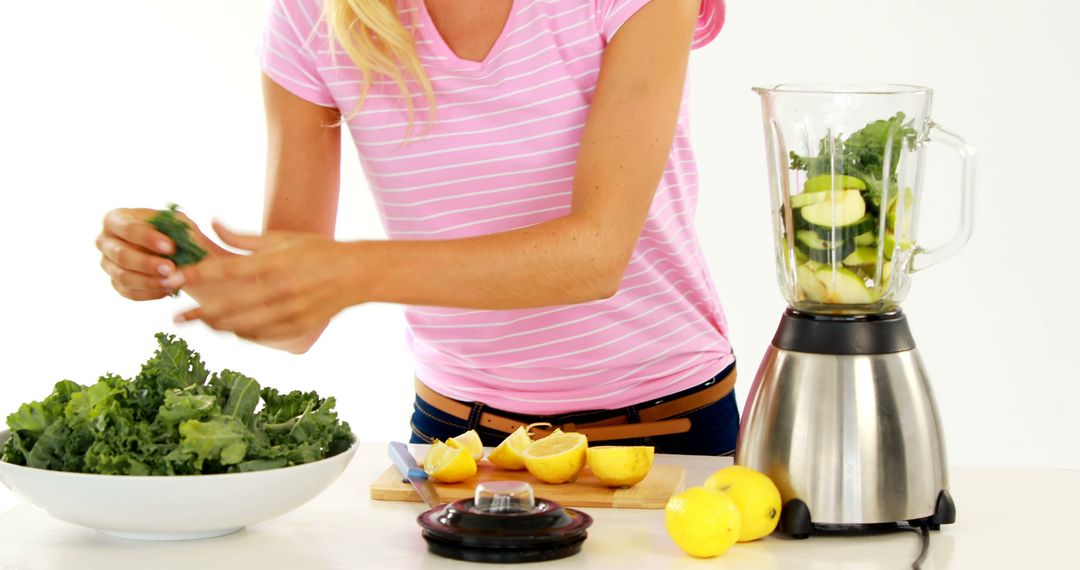 Woman Preparing Healthy Green Smoothie With Fresh Ingredients - Free Images, Stock Photos and Pictures on Pikwizard.com