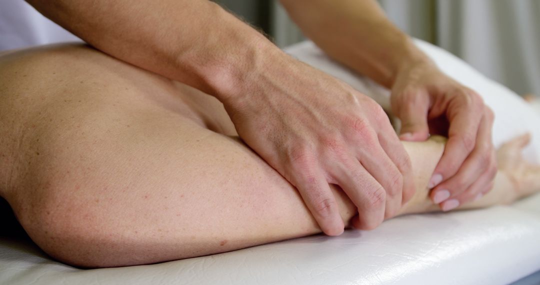 Physiotherapist Performing Leg Massage Therapy - Free Images, Stock Photos and Pictures on Pikwizard.com