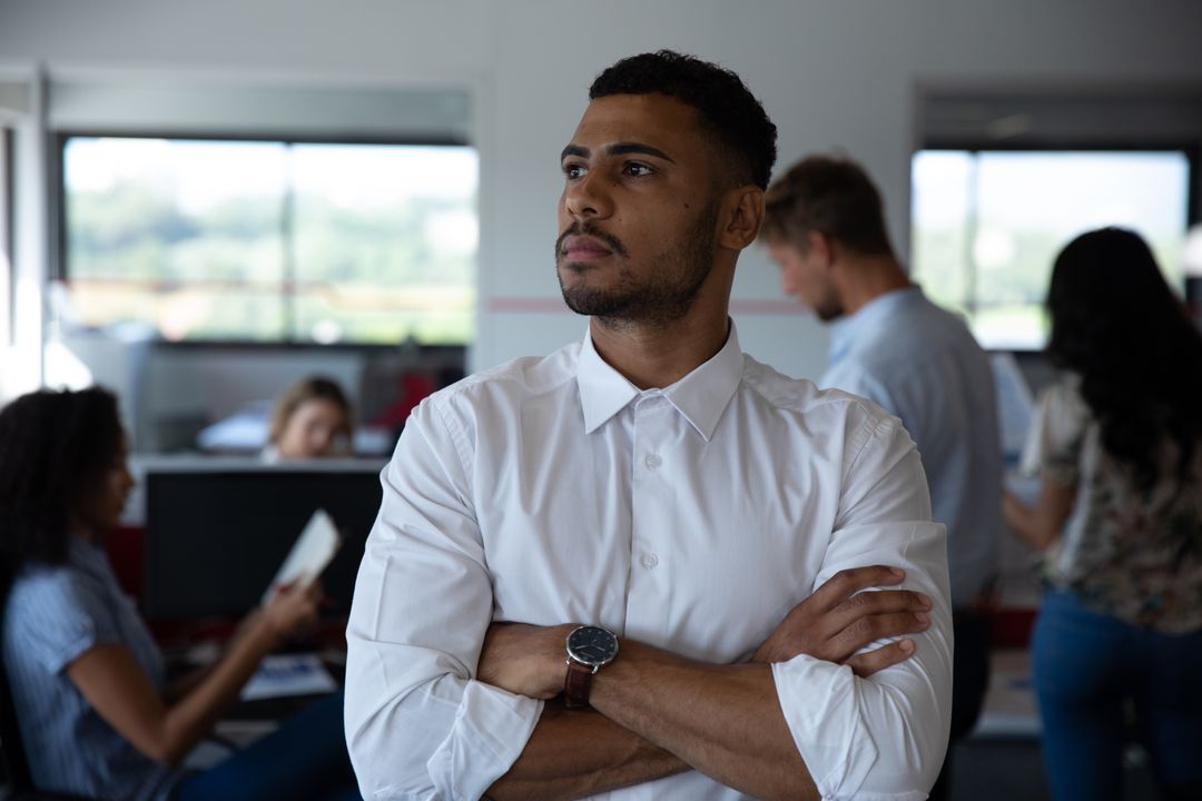 Thoughtful Biracial Businessman in Modern Office - Free Images, Stock Photos and Pictures on Pikwizard.com