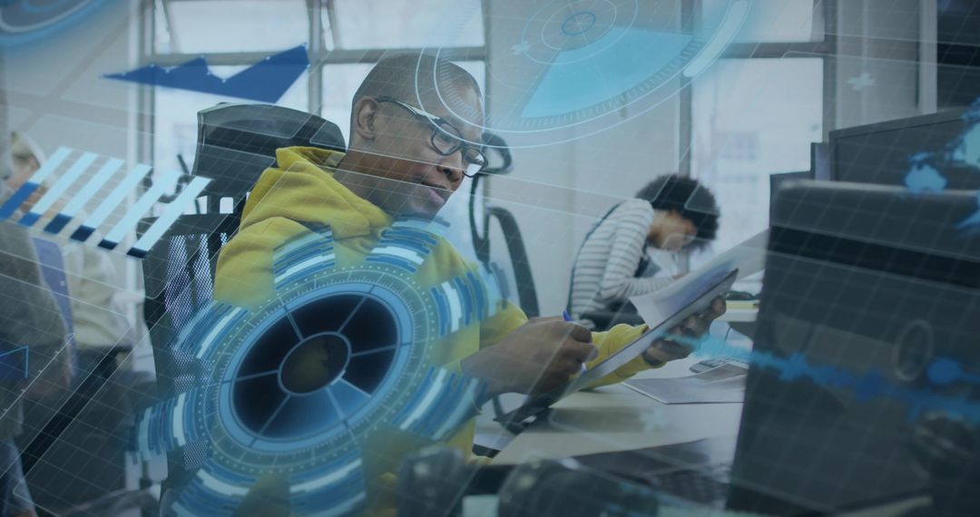Man in Yellow Hoodie Working in Cutting-Edge Office Environment