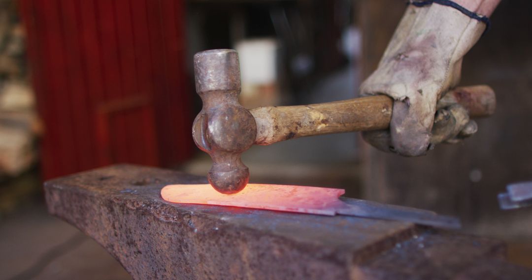 Blacksmith Hammering Hot Metal in Workshop - Free Images, Stock Photos and Pictures on Pikwizard.com