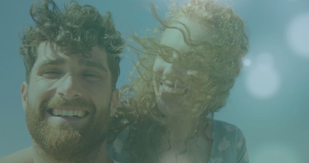 Couple Posing Playfully Underwater Smiling