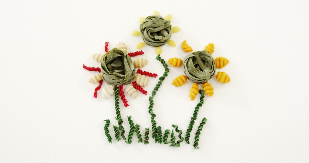 Creative Floral Arrangement Made of Assorted Pasta on White Background - Free Images, Stock Photos and Pictures on Pikwizard.com