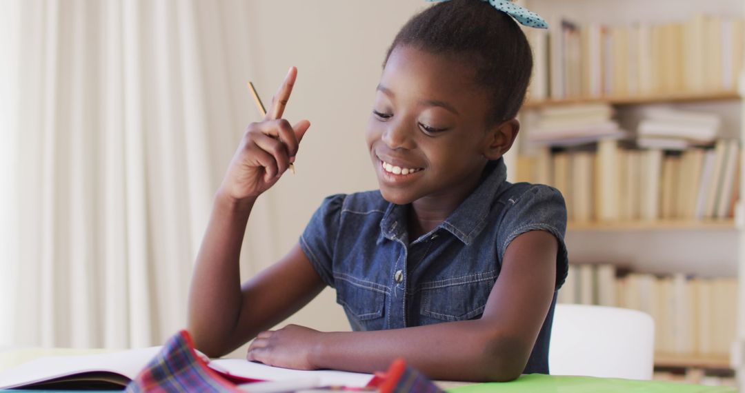 Young Girl Engaged in Homework at Home with Pencil in Hand