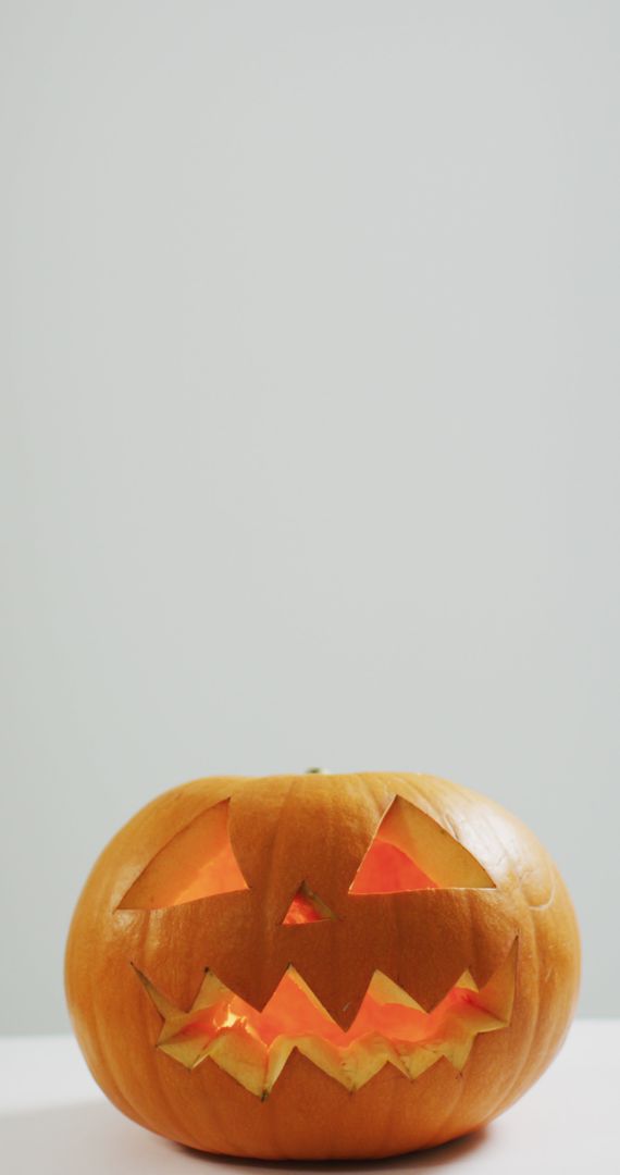 Festive Carved Halloween Pumpkin with Glowing Internal Light - Free Images, Stock Photos and Pictures on Pikwizard.com