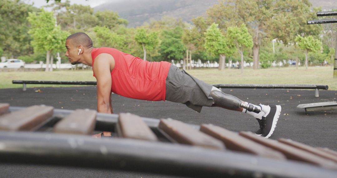 Fit Man with Prosthetic Leg Doing Plank at Outdoor Gym - Free Images, Stock Photos and Pictures on Pikwizard.com