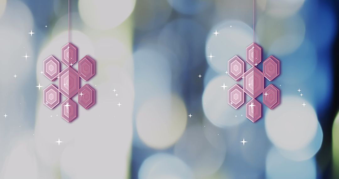 Pink Snowflake Baubles with Falling Snow on Blue Background