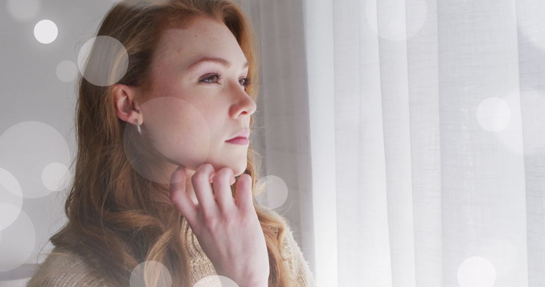 Daydreaming Woman Gazing Out Window with Soft Light Effects