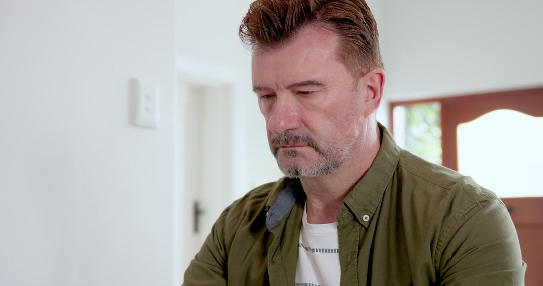 Thoughtful Man in Minimalist Home Interior