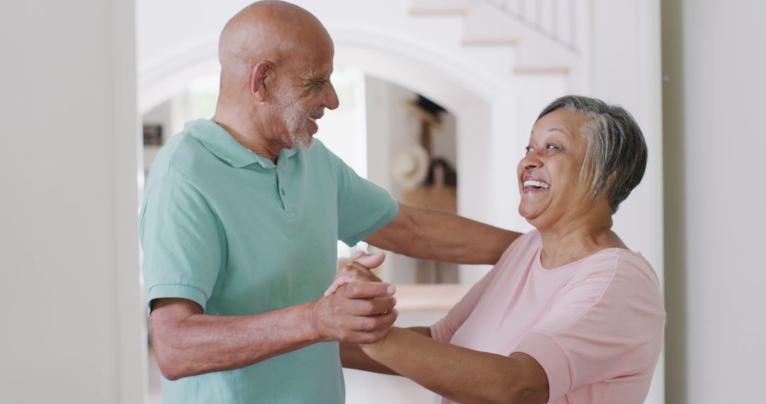 Senior Couple Dancing and Laughing at Home - Free Images, Stock Photos and Pictures on Pikwizard.com