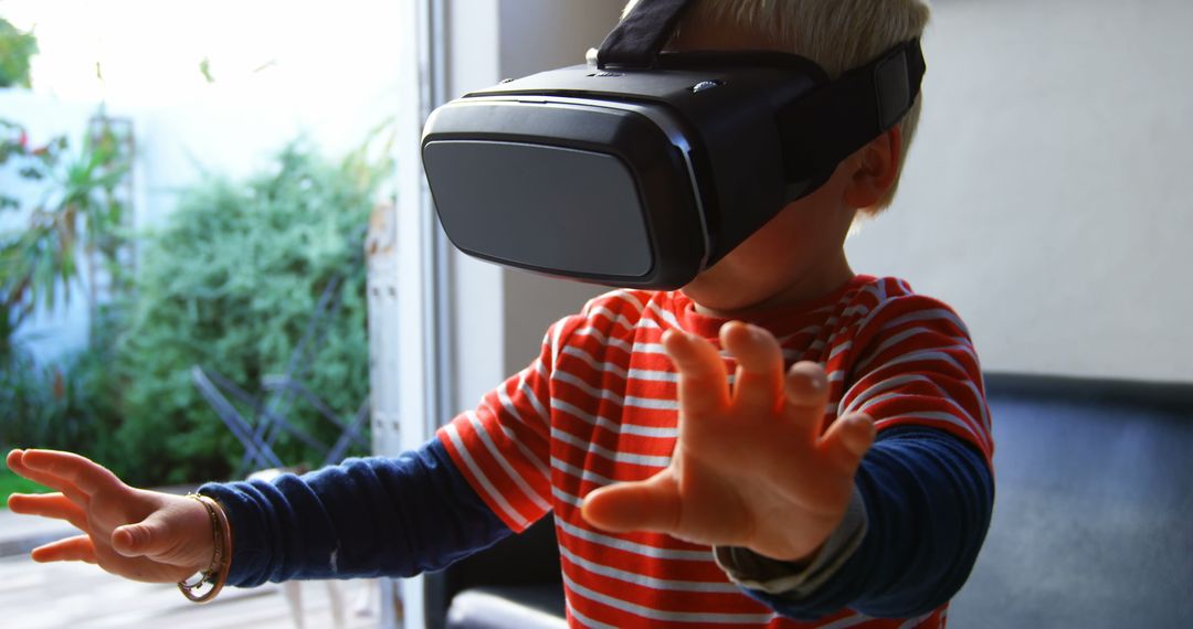 Young Boy Experiencing Virtual Reality at Home