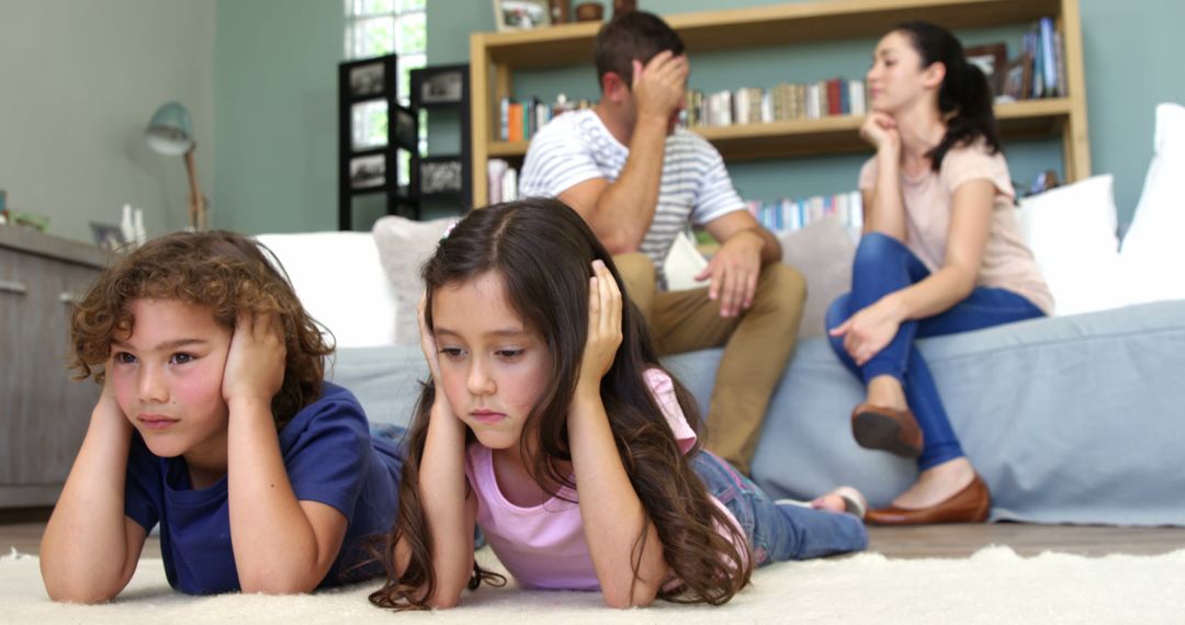 Children Covering Ears While Parents Arguing in Living Room - Free Images, Stock Photos and Pictures on Pikwizard.com