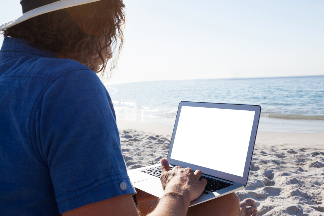 Transparent Man Working on Laptop Beachside Sunny Day - Download Free Stock Images Pikwizard.com