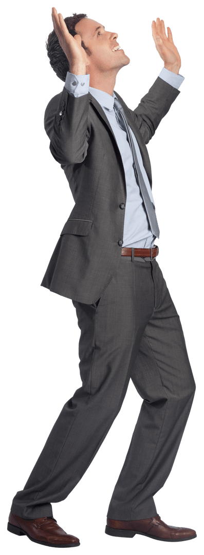 Successful Businessman Celebrating with Raised Arms in Gray Suit