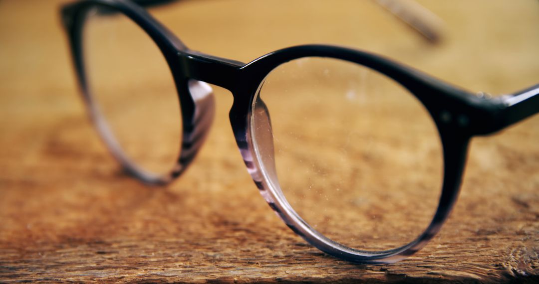 Close-Up of Modern Eyeglasses on Wooden Surface - Free Images, Stock Photos and Pictures on Pikwizard.com