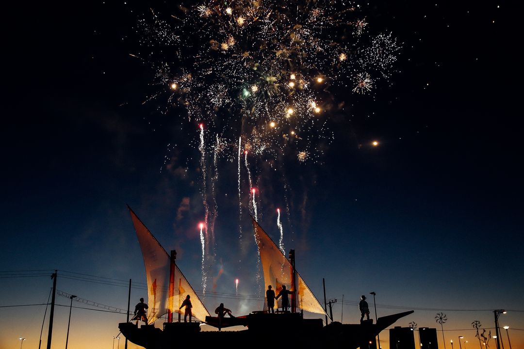 Spectacular Fireworks Display Over Event Silhouettes