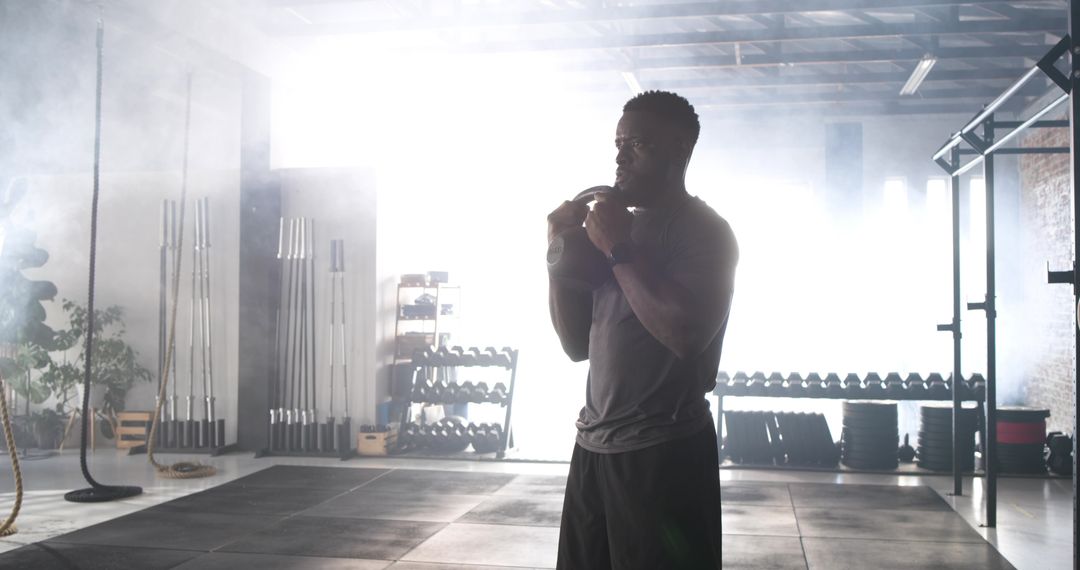 Determined Athlete Preparing in Modern Fitness Studio