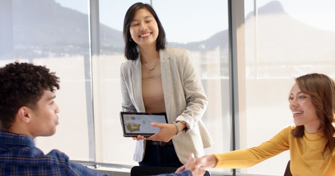 Diverse Coworkers Collaborating with Digital Technology in Modern Office