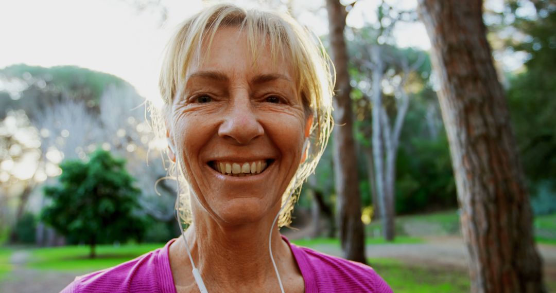 Smiling Senior Woman Enjoying Morning Exercise in Park - Free Images, Stock Photos and Pictures on Pikwizard.com