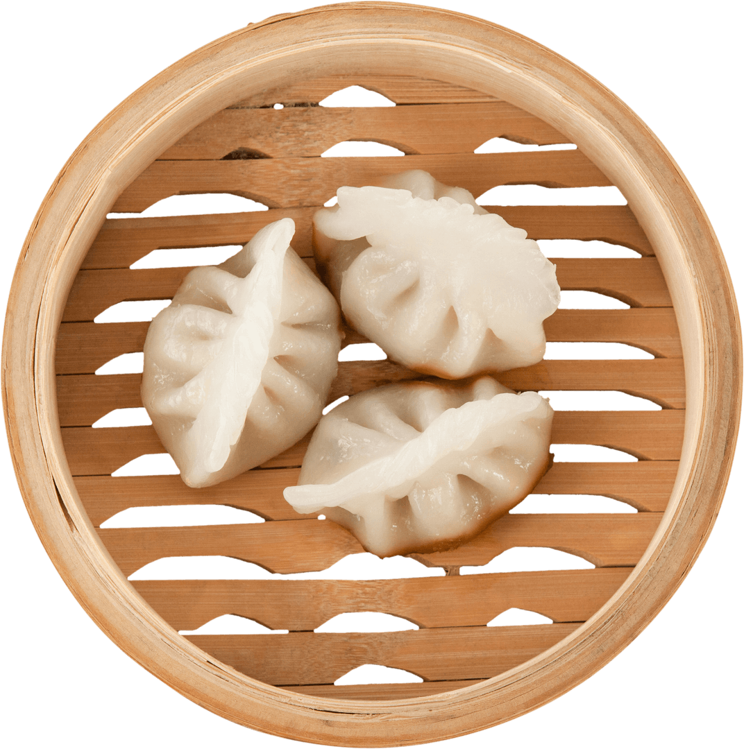 Close-Up of Dumplings in Transparent Wooden Steamer Basket