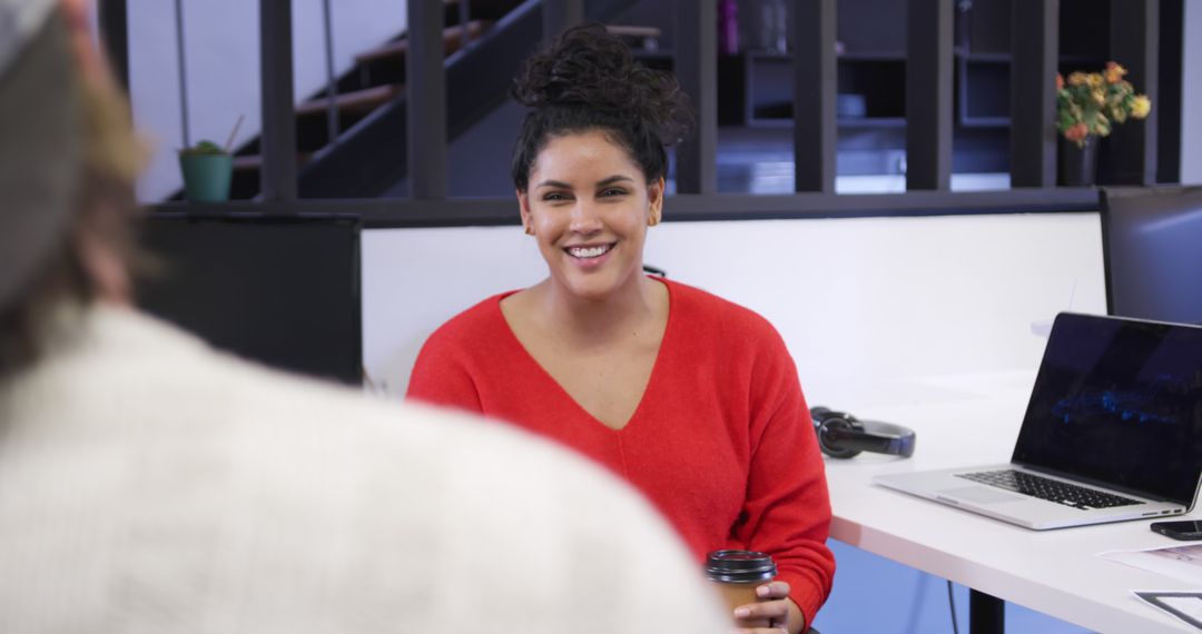 Smiling Businesswoman Engaging in Workplace Discussion