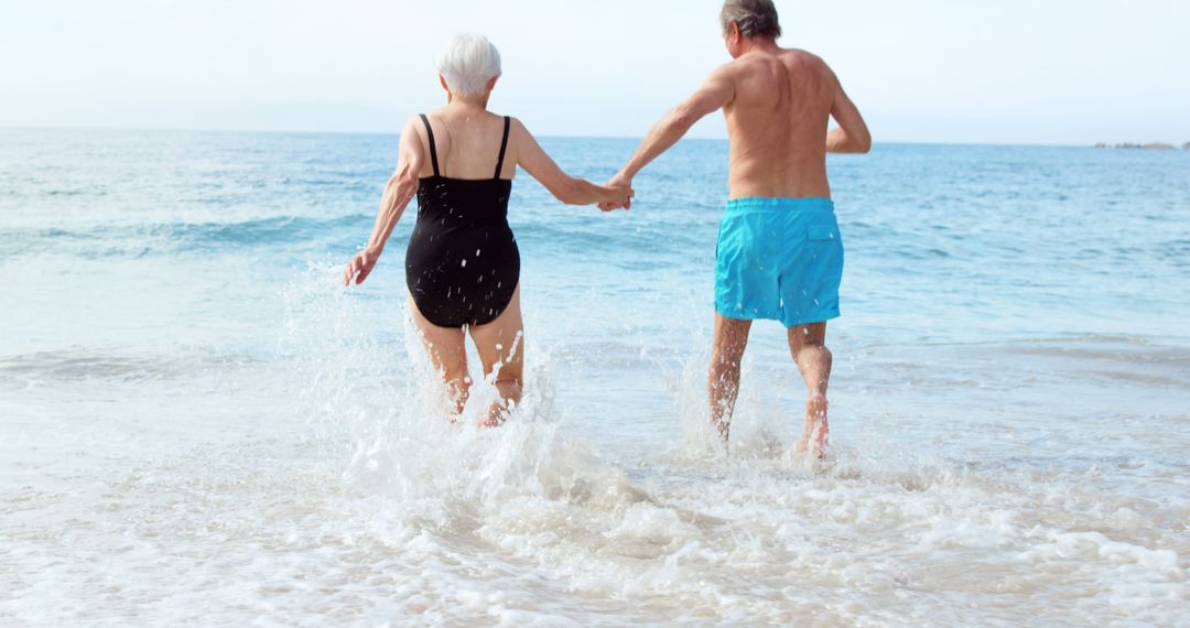 Senior Couple Enjoying Beach Vacation Together - Free Images, Stock Photos and Pictures on Pikwizard.com