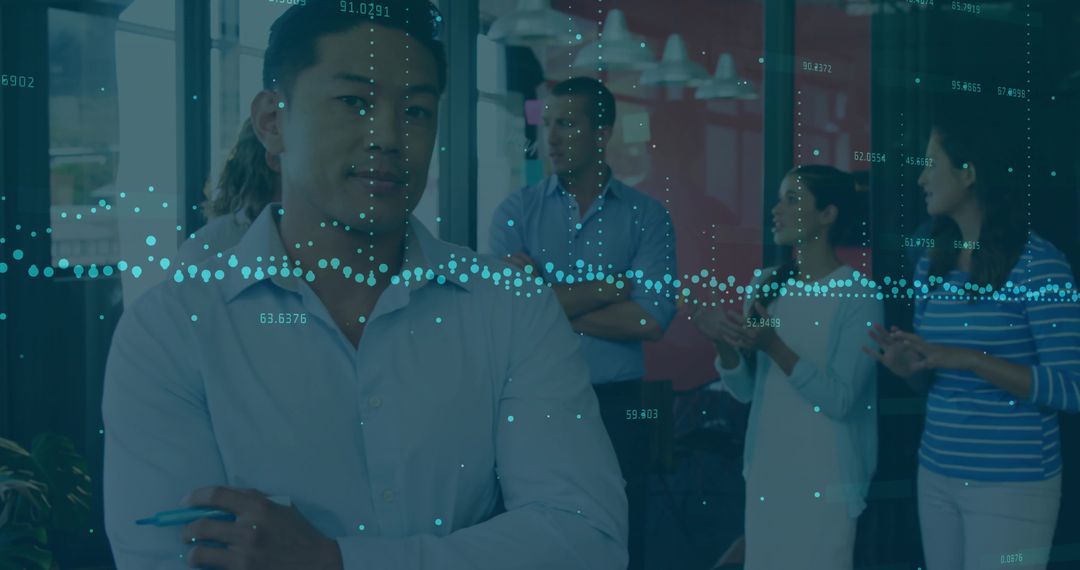 Colleagues Analyzing Data in Modern Meeting Room