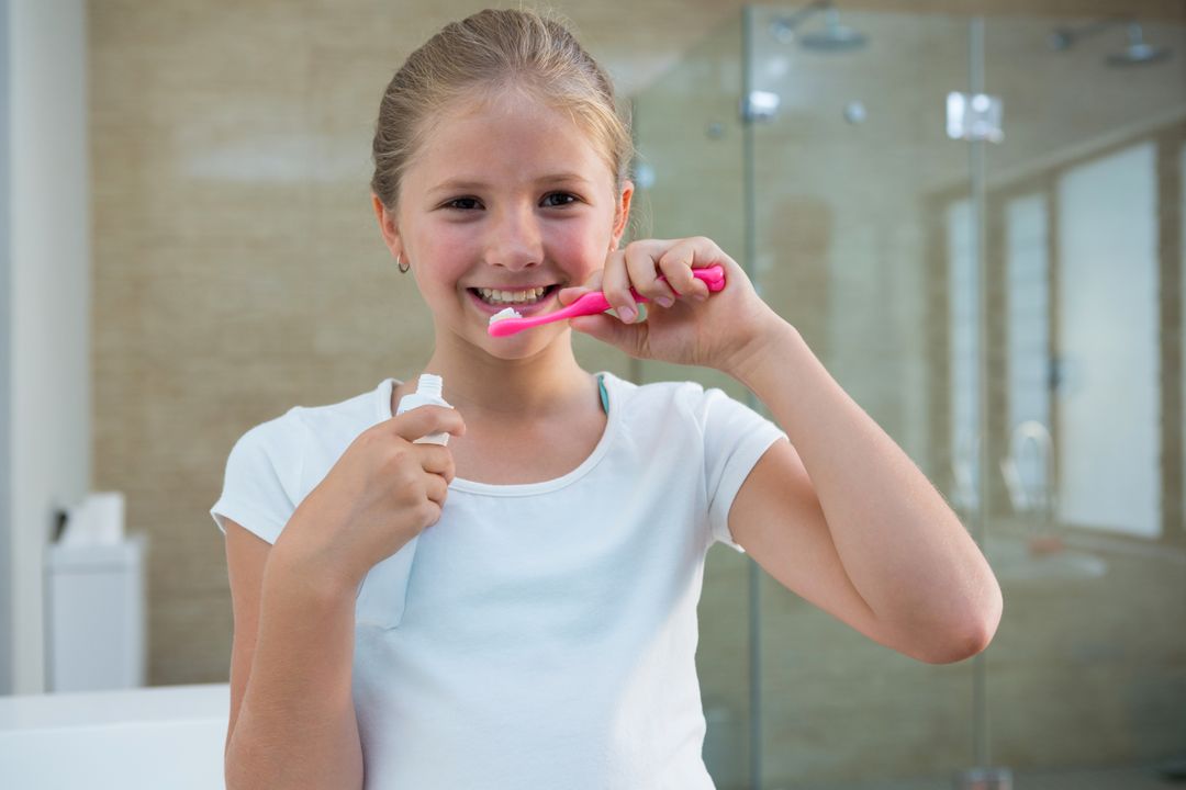 Portrait of girl brushing teeth - Free Images, Stock Photos and Pictures on Pikwizard.com