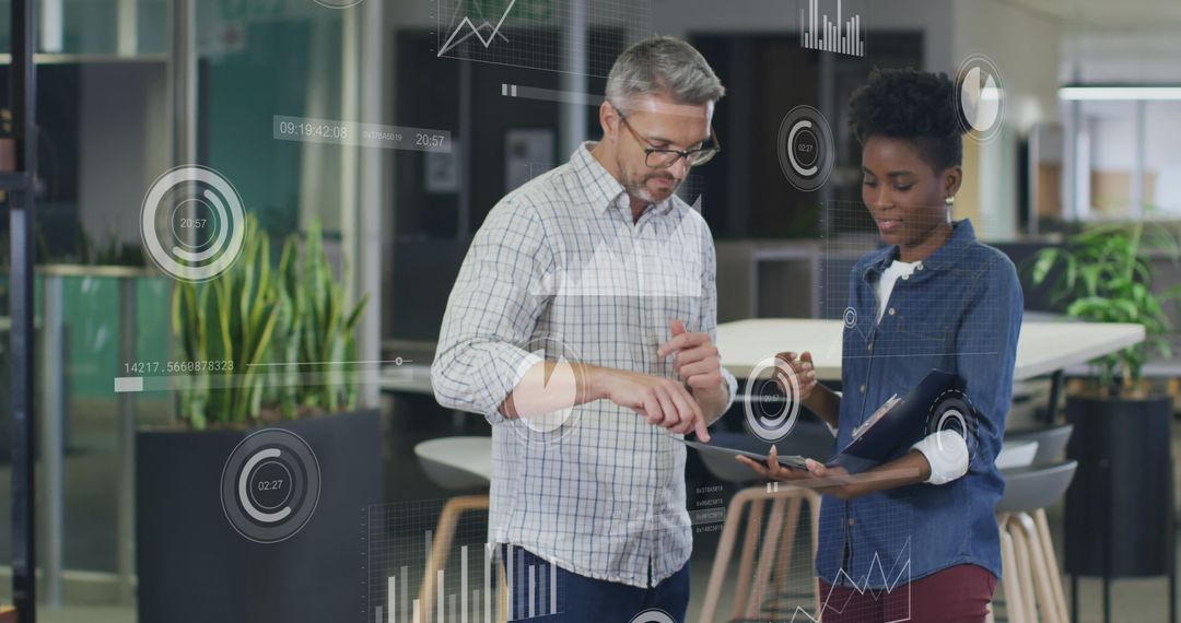 Diverse Colleagues Analyzing Digital Data in Office Environment