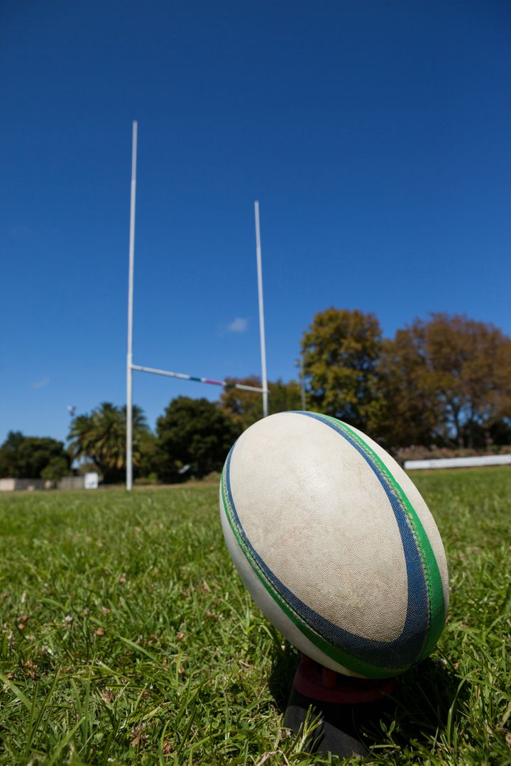 Close-up of Rugby Ball on Field with Goal Posts - Free Images, Stock Photos and Pictures on Pikwizard.com