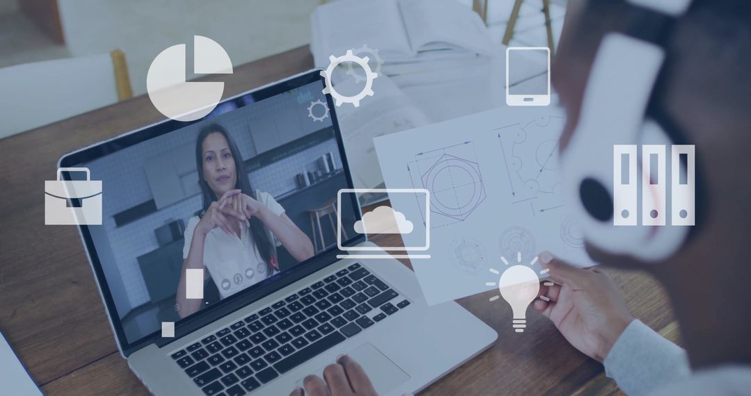 Man Analyzing Blueprint During Video Call Home Office Setup