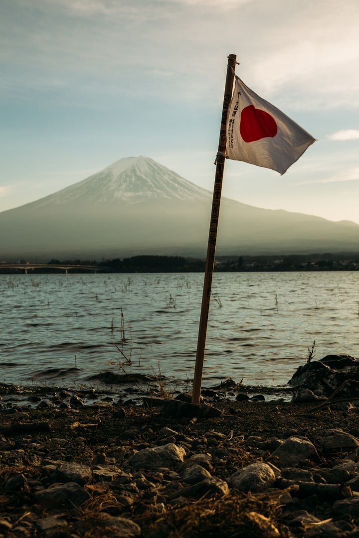 Japanese Flag on Pole Near Mount Fuji at Sunset - Free Images, Stock Photos and Pictures on Pikwizard.com