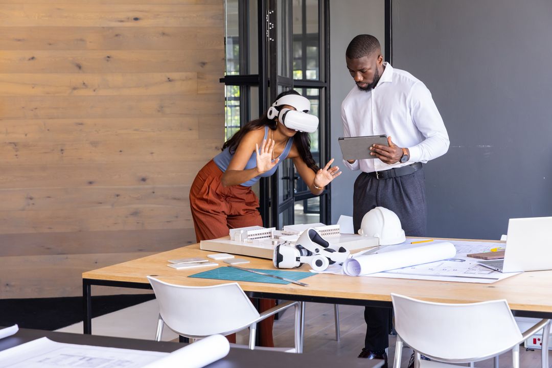 Designers Using VR Technology Over Architectural Planning Table