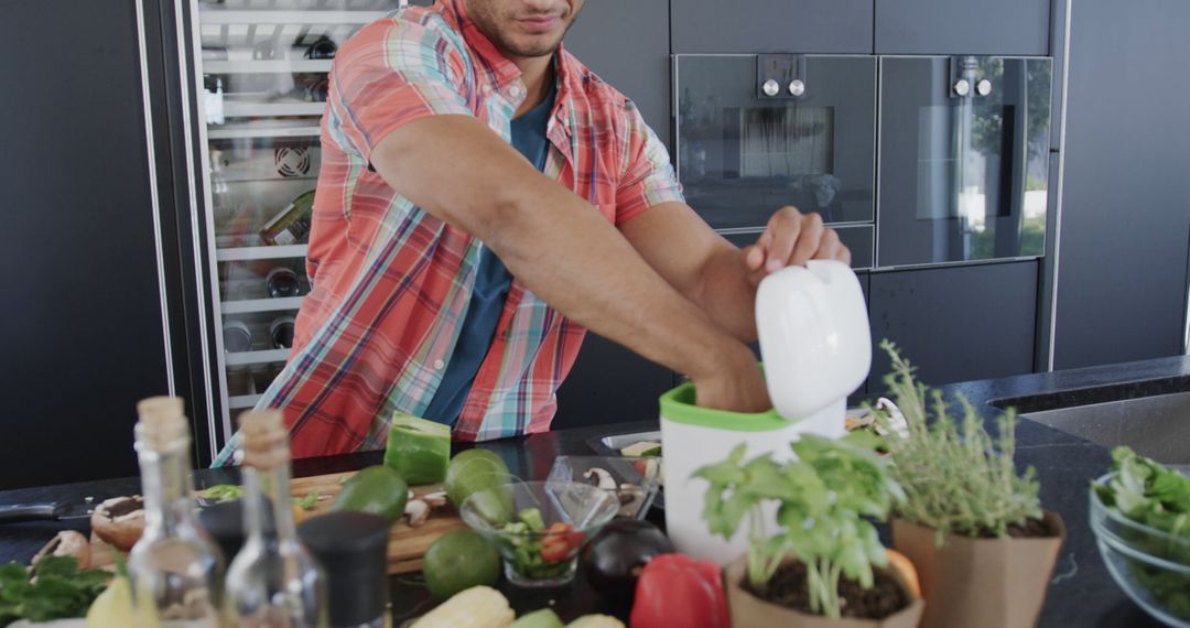 Man preparing vegetables in modern kitchen - Free Images, Stock Photos and Pictures on Pikwizard.com