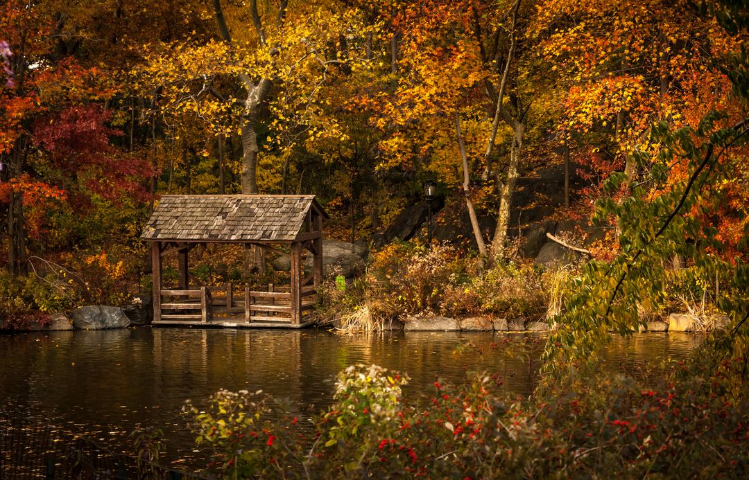 Scenic Autumn Lake with Rustic Wooden Boathouse - Free Images, Stock Photos and Pictures on Pikwizard.com
