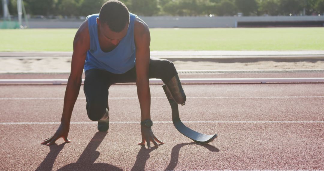 Paralympic Sprinter Preparing for Race with Running Blade in Track Stadium - Free Images, Stock Photos and Pictures on Pikwizard.com