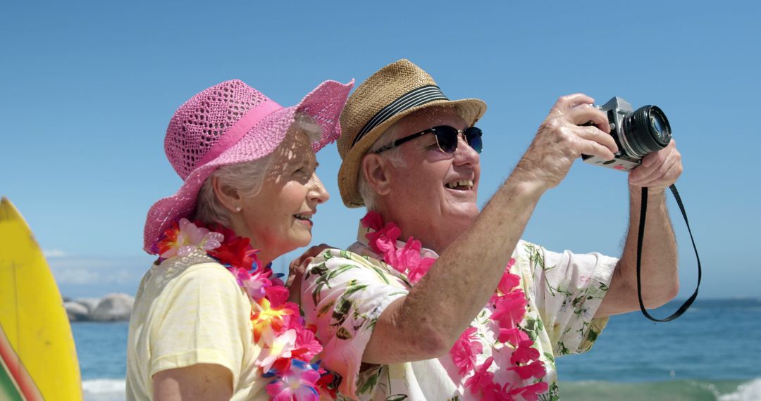 Smiling Senior Couple Taking Selfie on Tropical Summer Beach Vacation - Free Images, Stock Photos and Pictures on Pikwizard.com