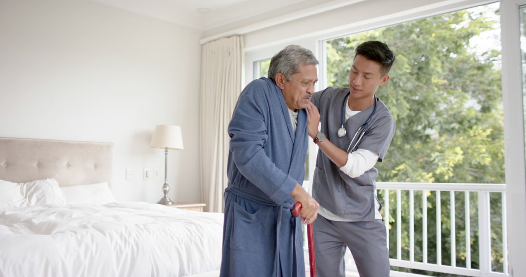 Nurse Helping Elderly Man With Mobility in Bedroom - Free Images, Stock Photos and Pictures on Pikwizard.com