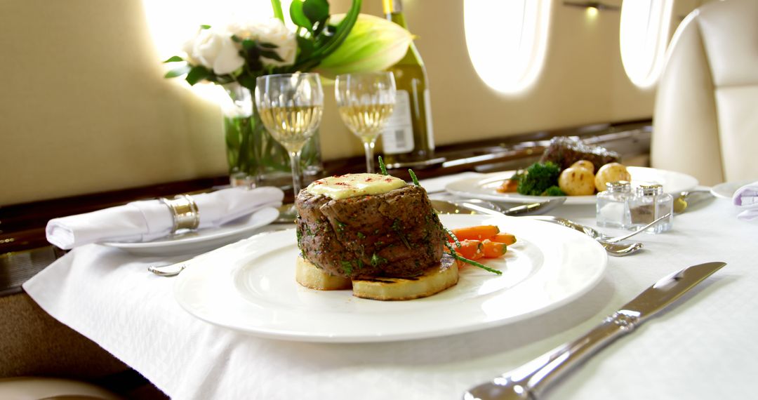 Gourmet meal served on a private jet, indicating luxury travel - Free Images, Stock Photos and Pictures on Pikwizard.com