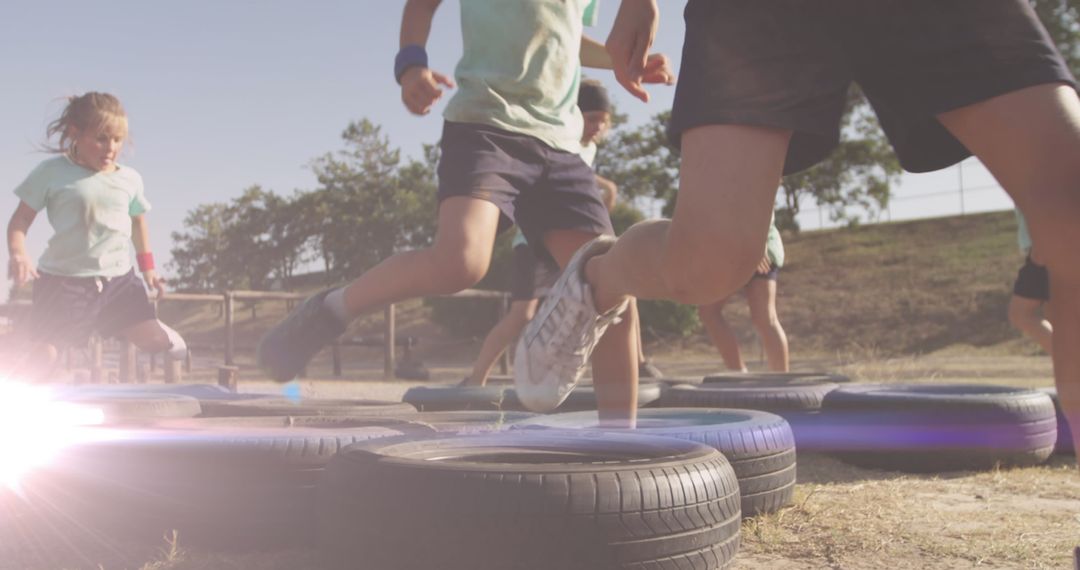 Children Joyfully Playing on Outdoor Obstacle Course